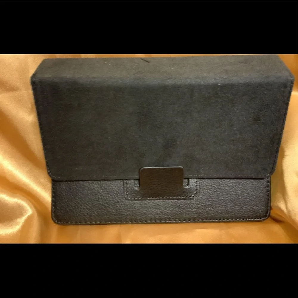 Black tablet cover, Magnetic closure, Measures @ 7 1/2” x 5”, NWT